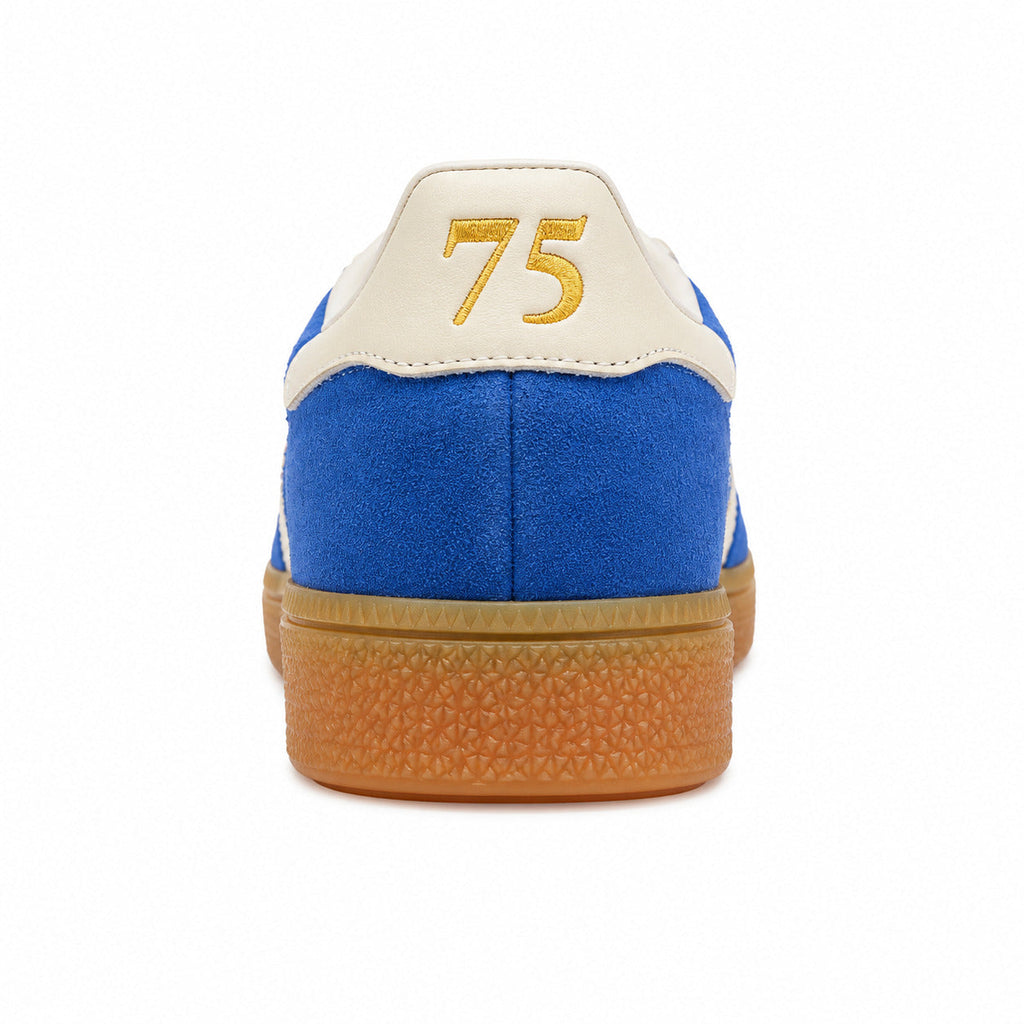 Adidas Handball Spezial azul crema detalle talón bordado 75 dorado