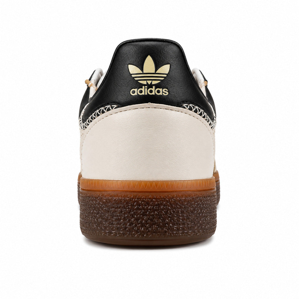 Adidas Handball Spezial crema negro detalle contrafuerte trasero logo dorado