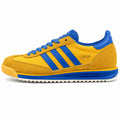 Adidas SL 72 amarillo mostaza bandas azul royal suela crema perfil izquierdo