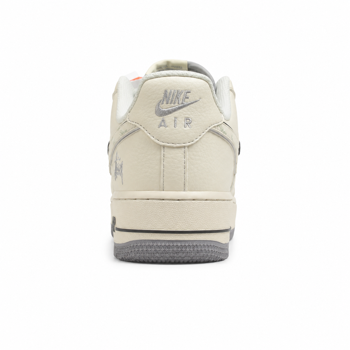 Nike Air Force 1 Low x Stussy beige gris talón detalle bordado