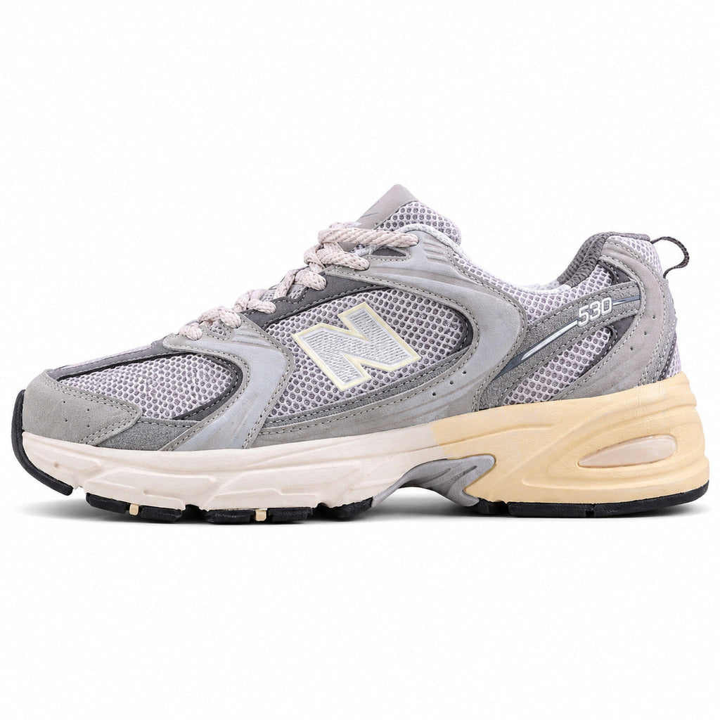 New Balance 530 gris crema ante vista lateral izquierda