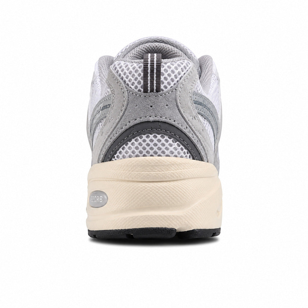 New Balance 530 gris crema detalle talón suela crema
